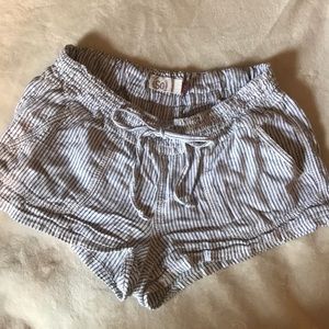 Striped white and navy blue shorts.